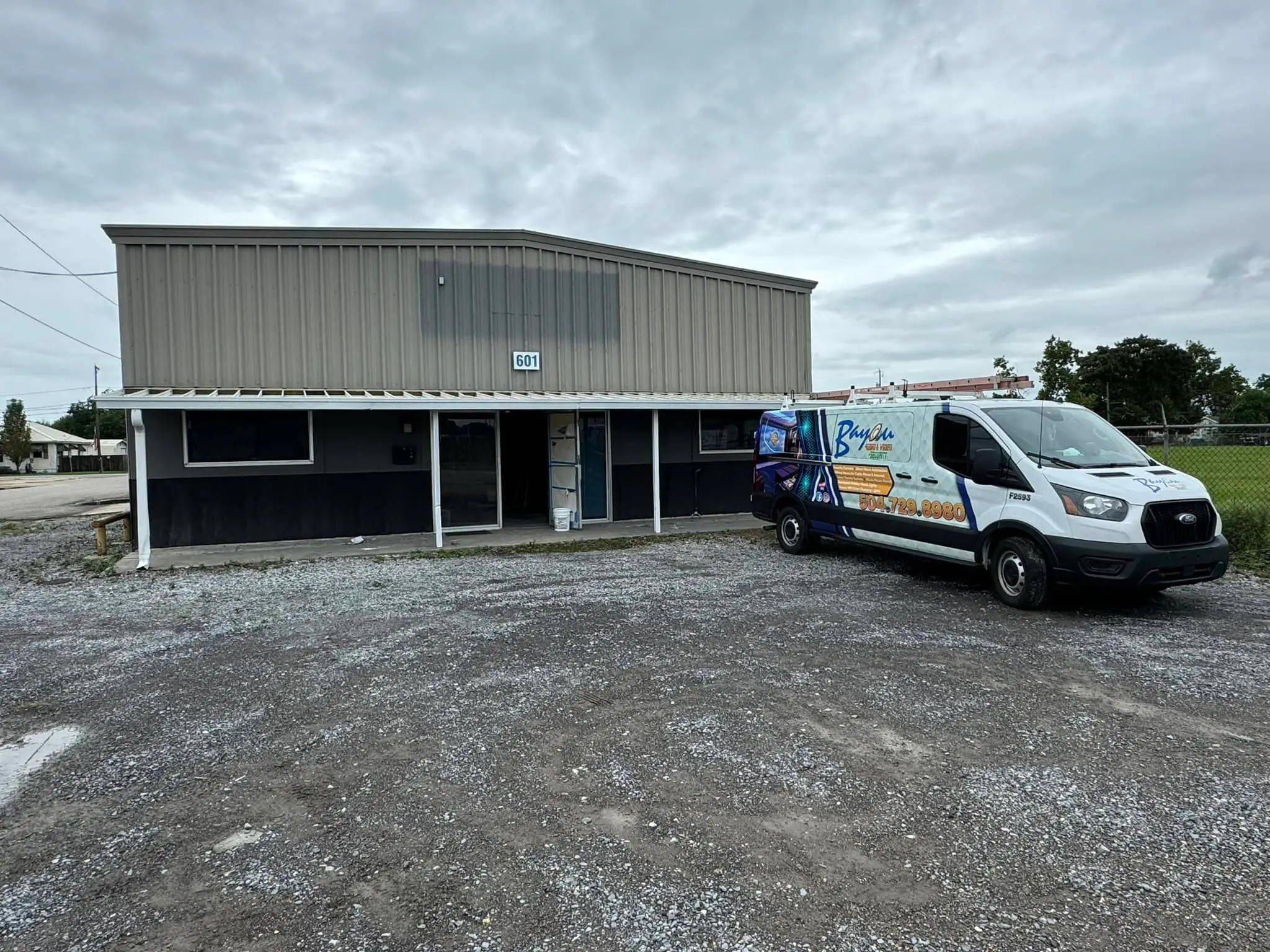 Whole-business audio and video in a Westbank building: interior wide photo, brighter toward the top, photo 4.