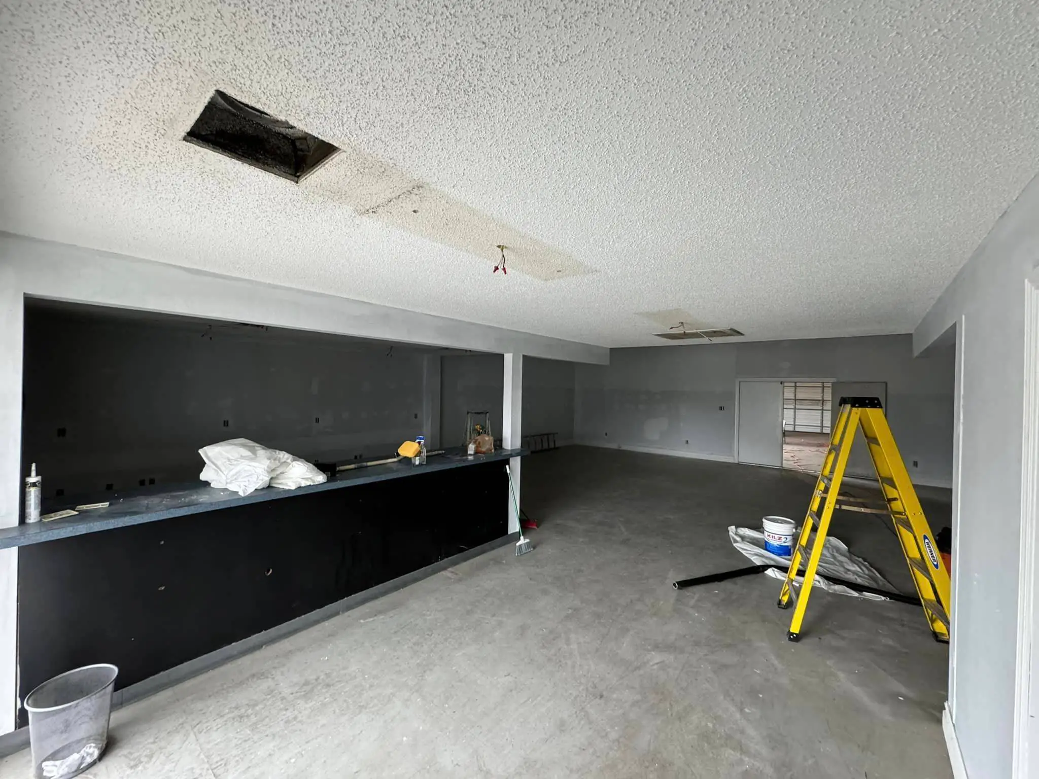 Whole-business audio and video in a Westbank building: interior wide photo, brighter toward the top, photo 5.