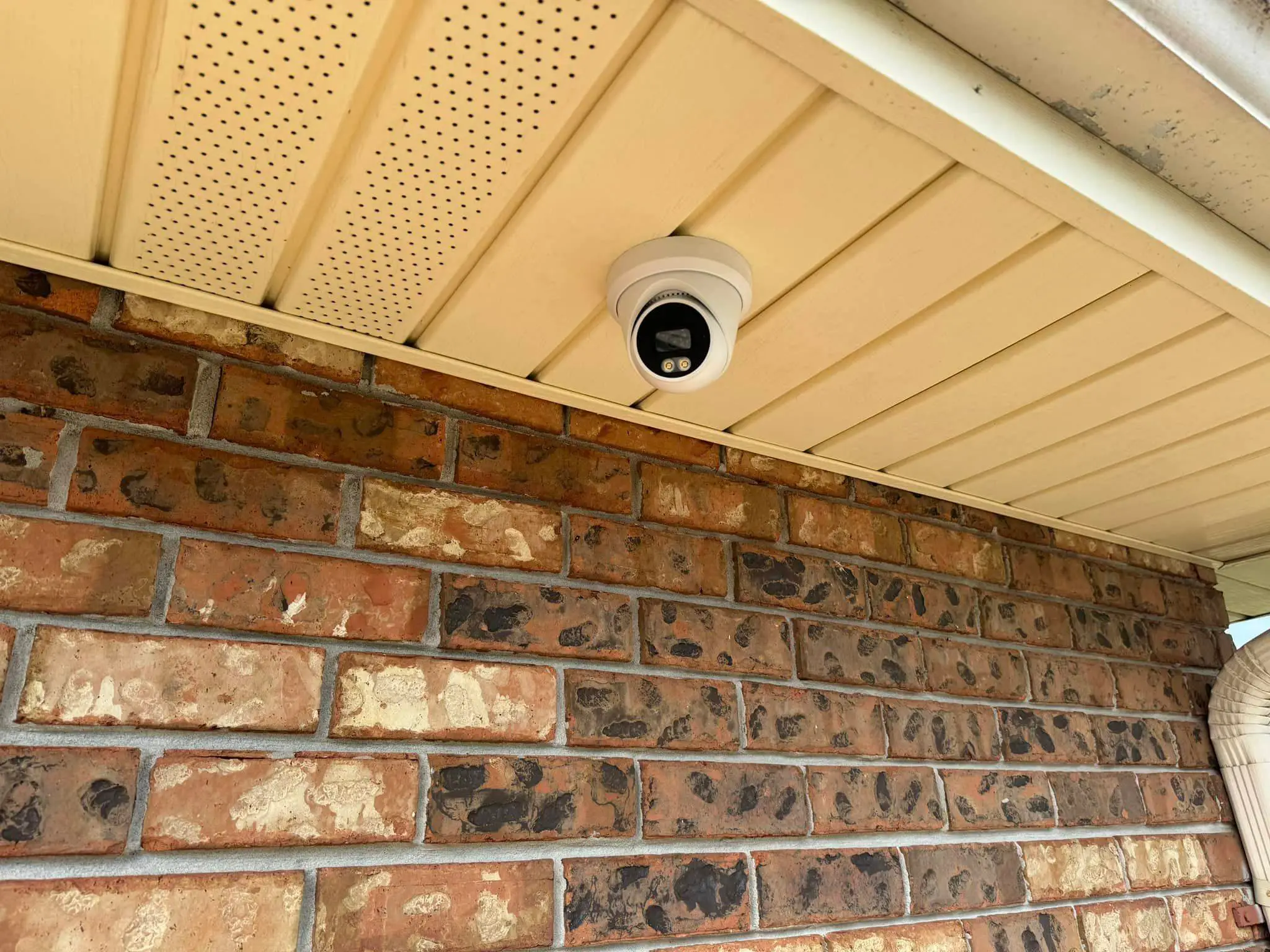 Residential alarm, camera, or AV gear on the Westbank: interior wide photo, red light, brighter toward the top.