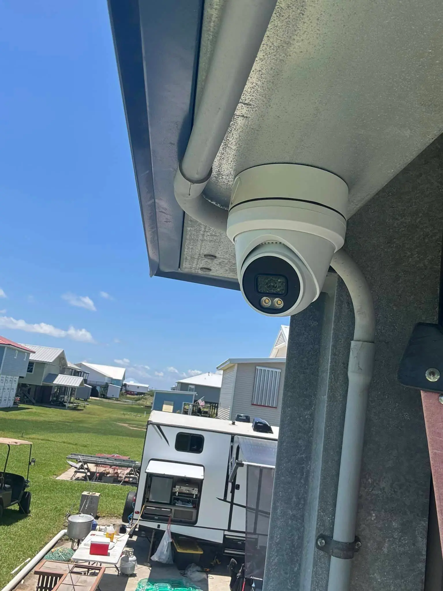 Residential alarm, camera, or AV gear on the Westbank: interior tall photo, blue light, brighter toward the top.