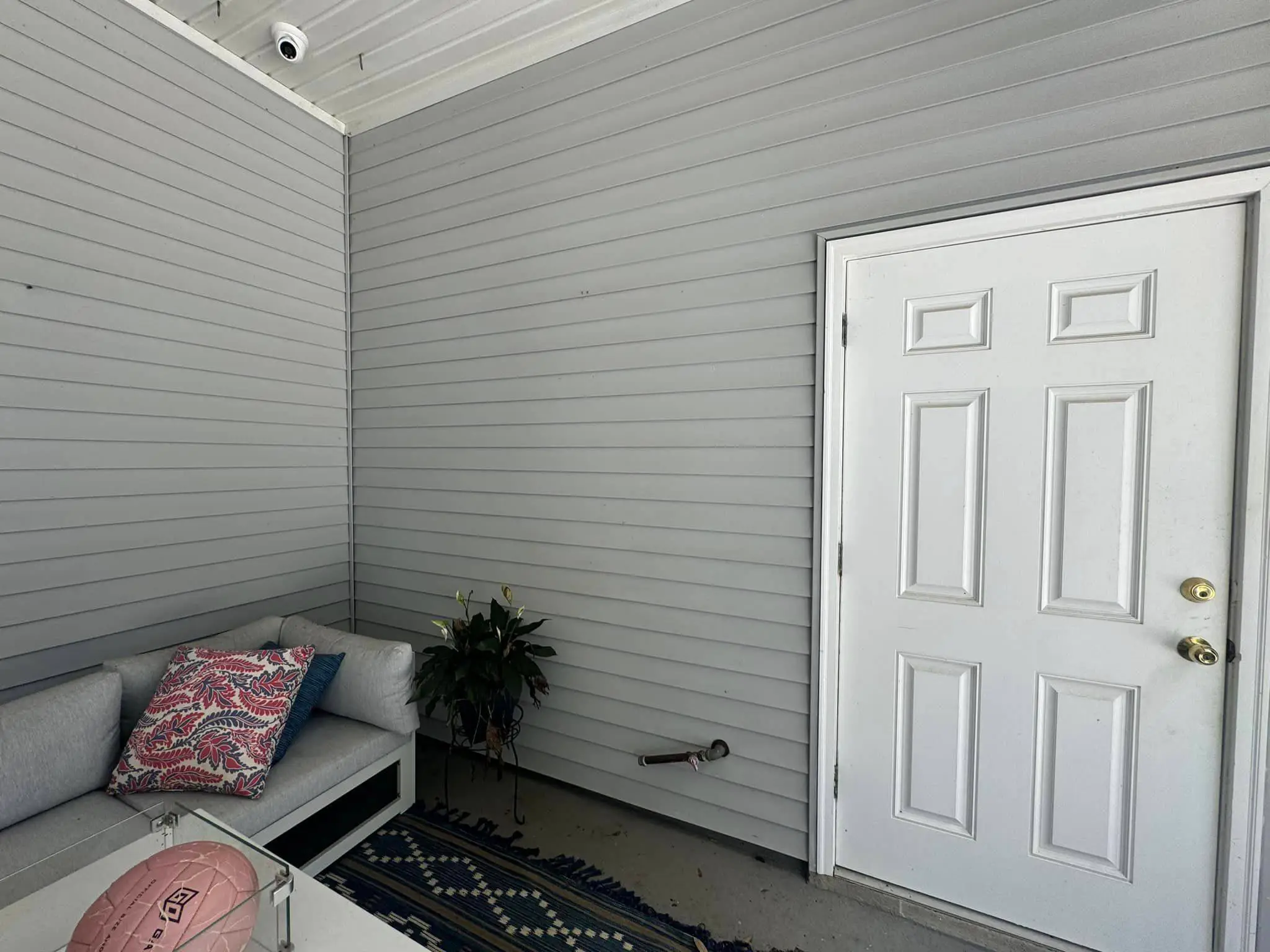 Residential alarm, camera, or AV gear on the Westbank: daylight wide photo, brighter toward the top.