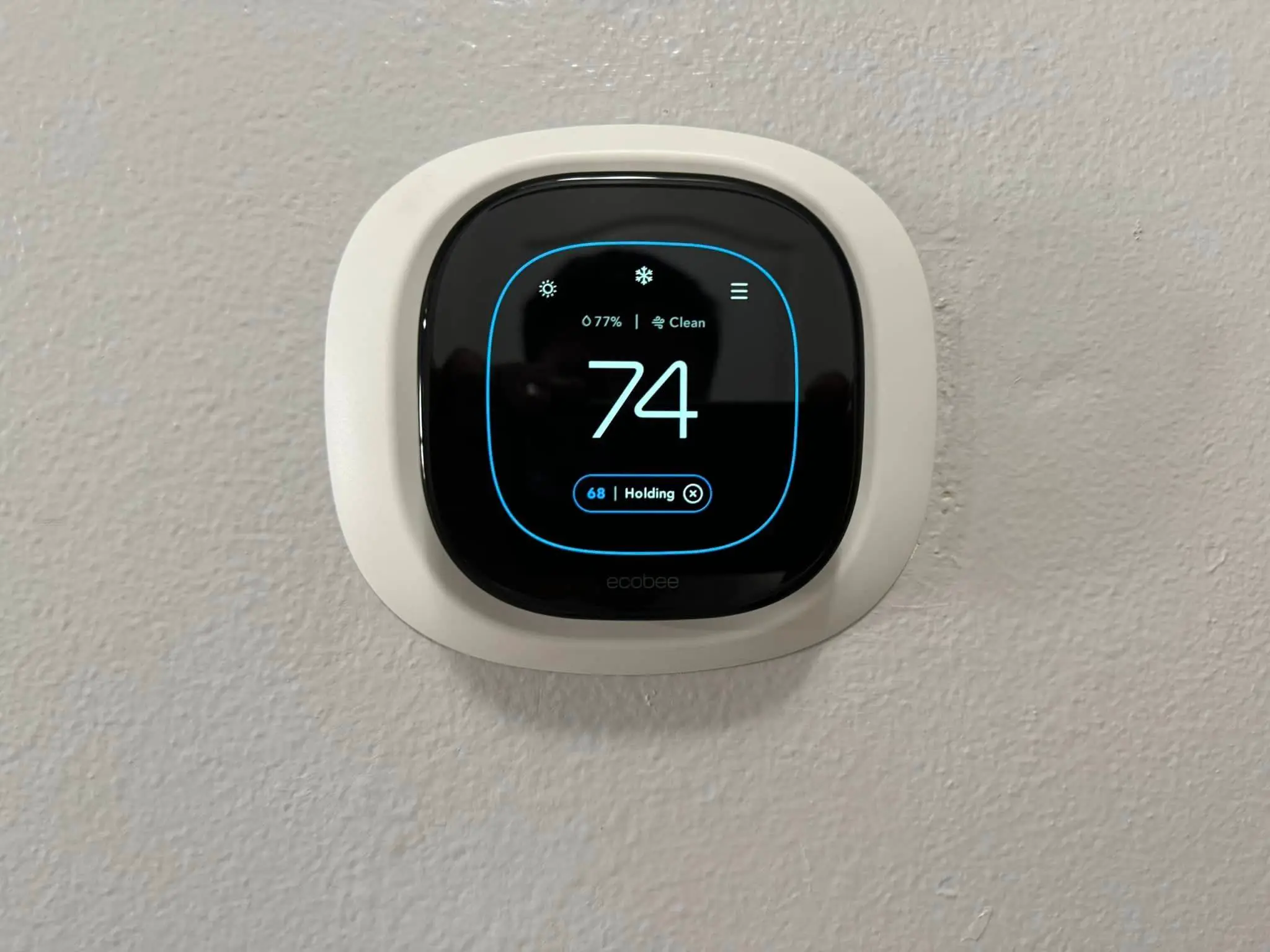 Smart-home camera, keypad, or screen on the Westbank: daylight wide photo, even light across the frame.