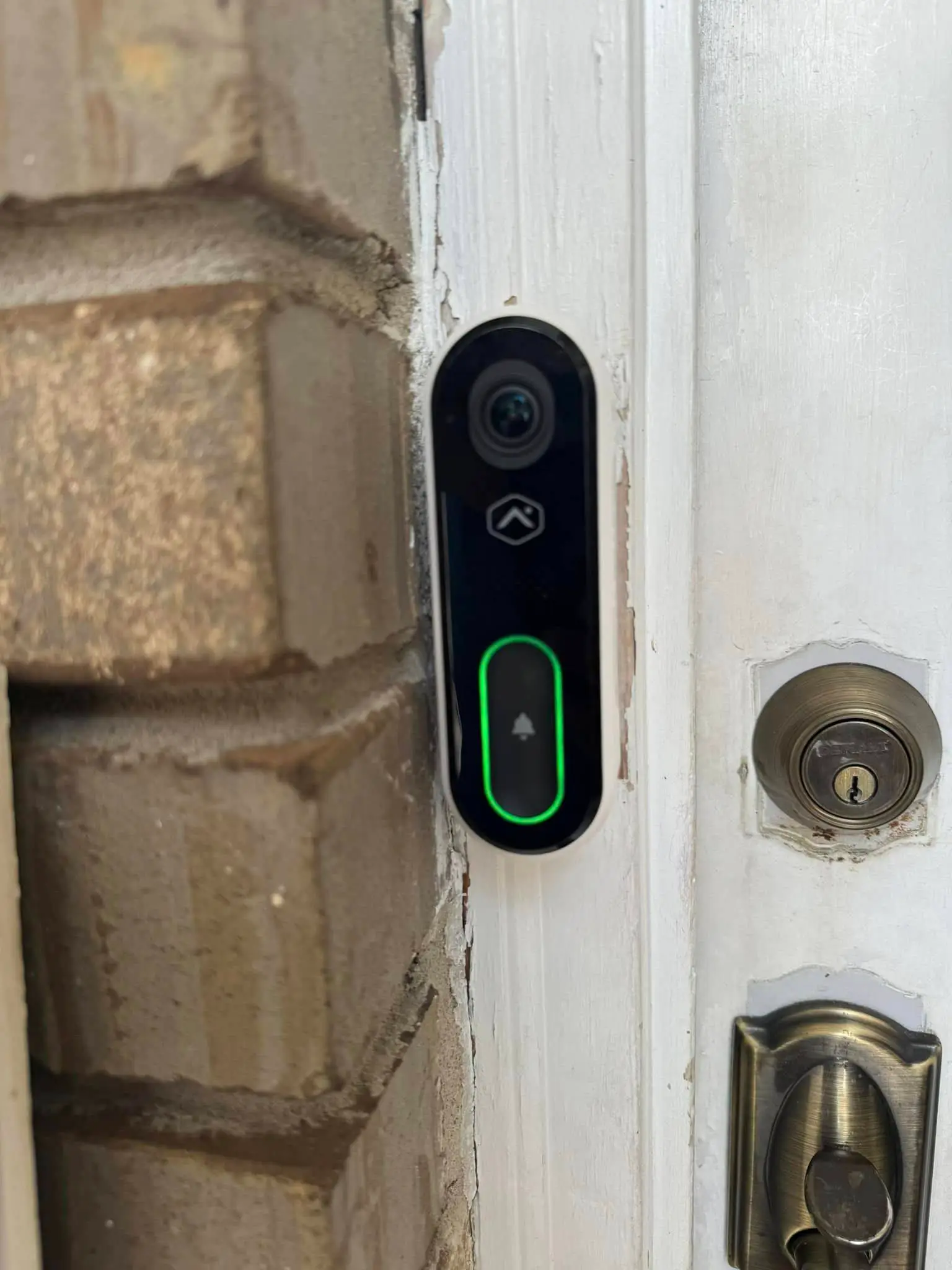 Smart-home camera, keypad, or screen on the Westbank: interior tall photo, brighter toward the top.