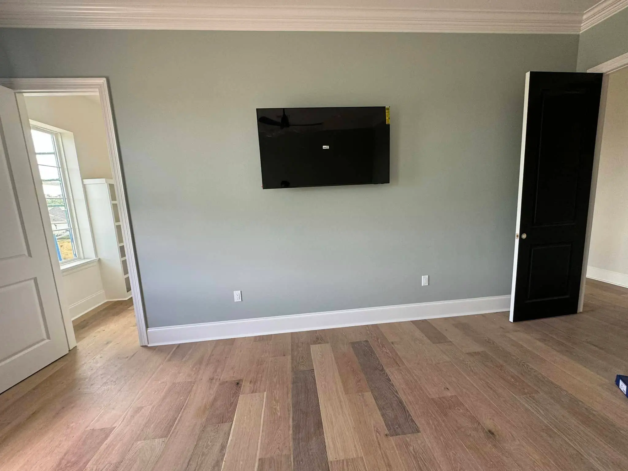 Home theater screen or rack on the Westbank: interior wide photo, warm light, even light across the frame.
