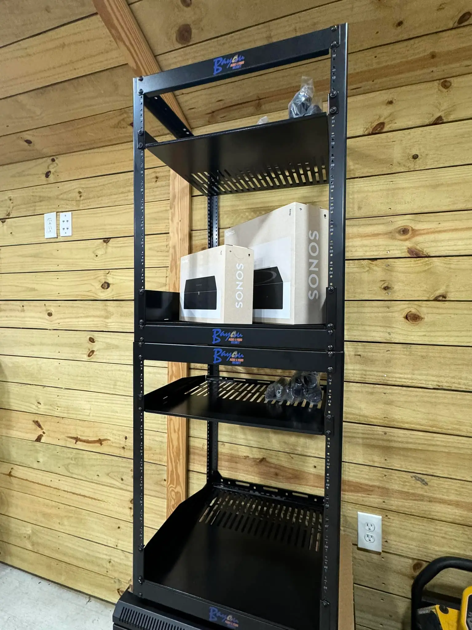 Whole-home speaker, screen, or rack on the Westbank: interior tall photo, warm light, even light across the frame.