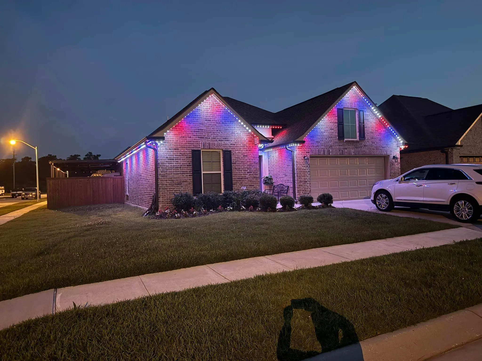 Trimlight on a Westbank house: interior wide photo, brighter toward the top.