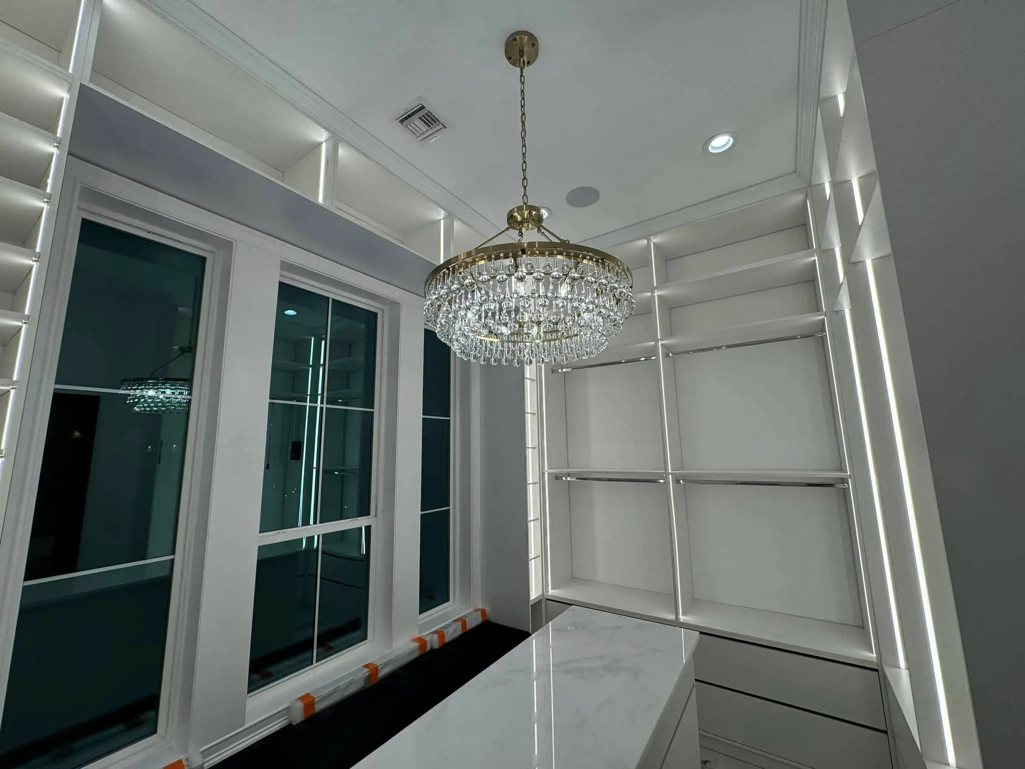 Under-cabinet lights in a Westbank kitchen: interior wide photo, brighter toward the top, photo 13.