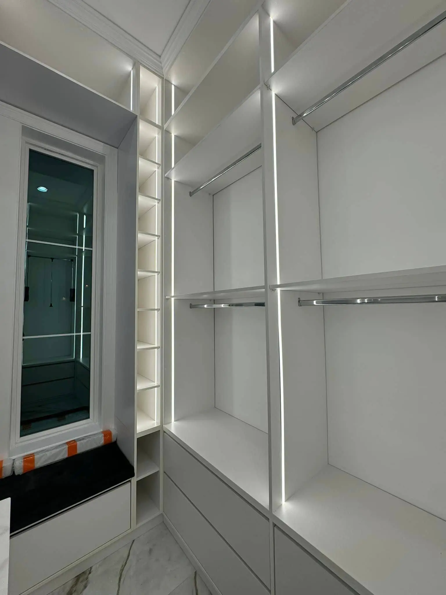 Under-cabinet lights in a Westbank kitchen: interior tall photo, even light across the frame, photo 2.