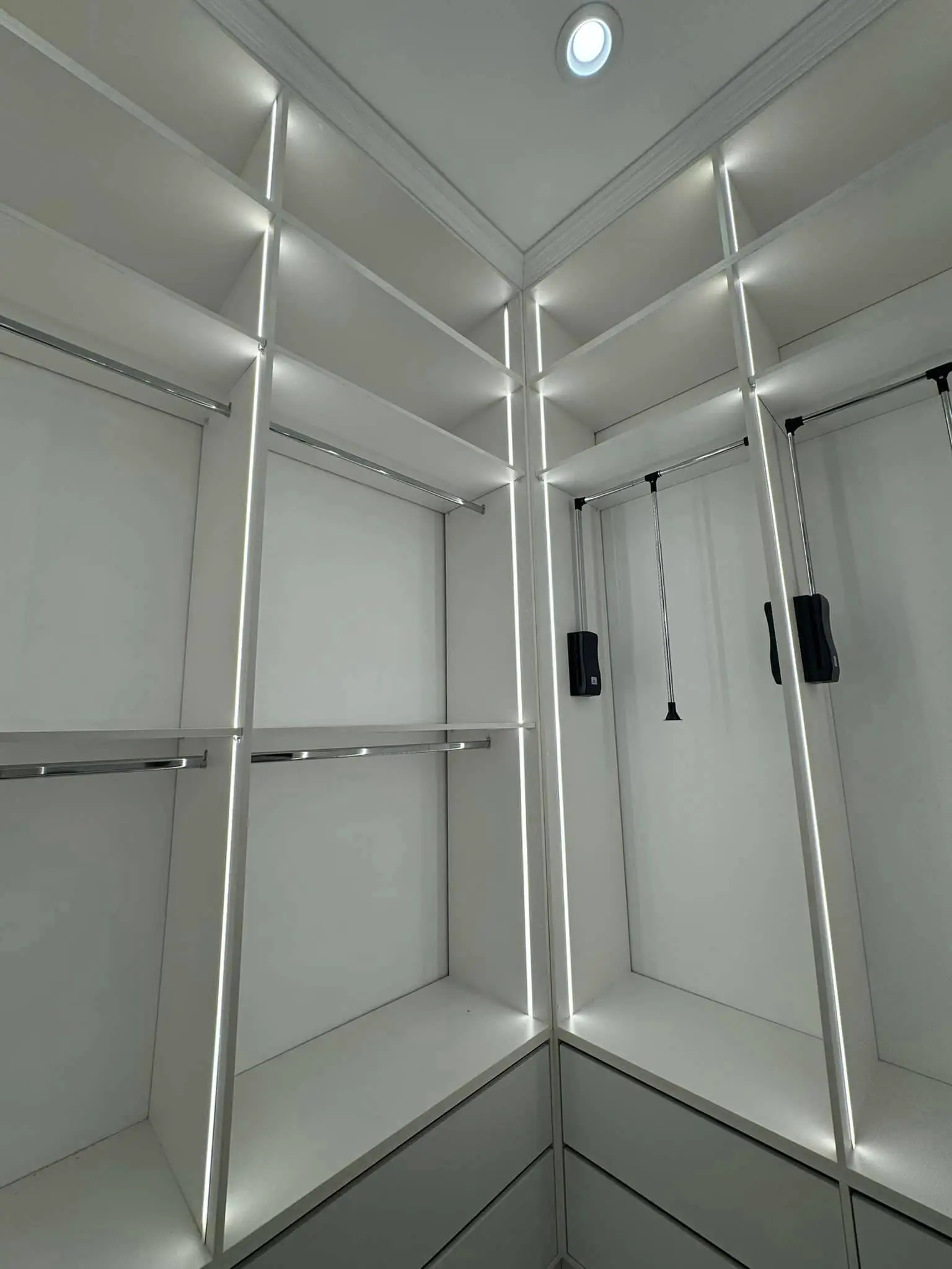 Under-cabinet lights in a Westbank kitchen: interior tall photo, even light across the frame, photo 9.