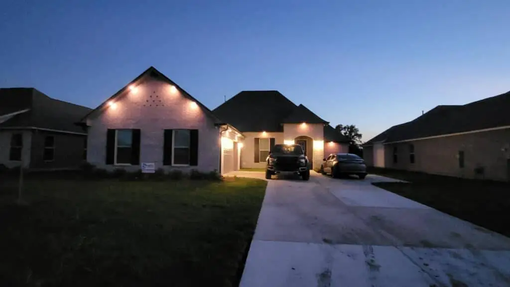 Downlights on a Westbank house, installed with Trimlight: interior wide photo, blue light, brighter toward the top.